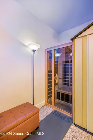 a view of a chair and table in the garden