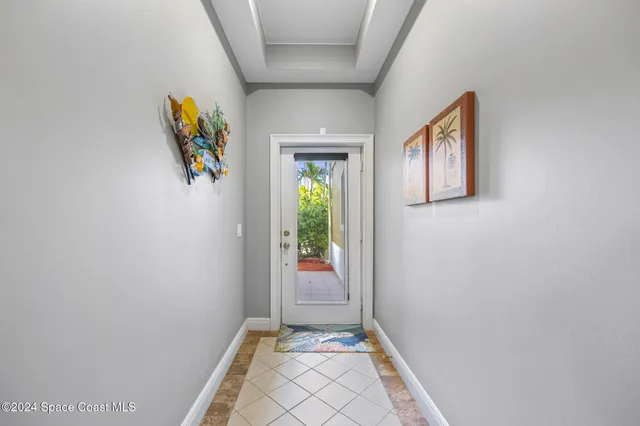 a view of an entryway and wooden floor