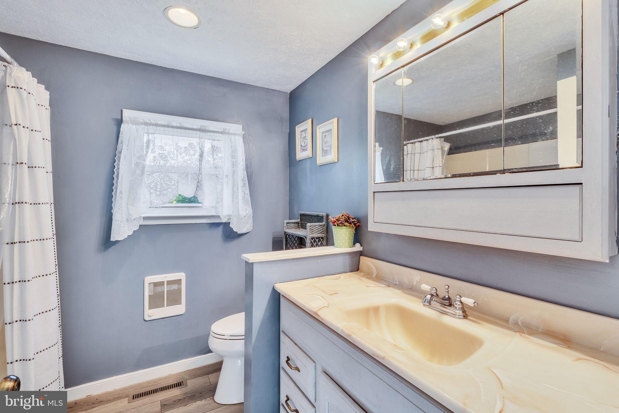 529 Taylors Beach Road Reedville, VA 22539 - Photo 19 of 57 Charming bathroom with serene hues.