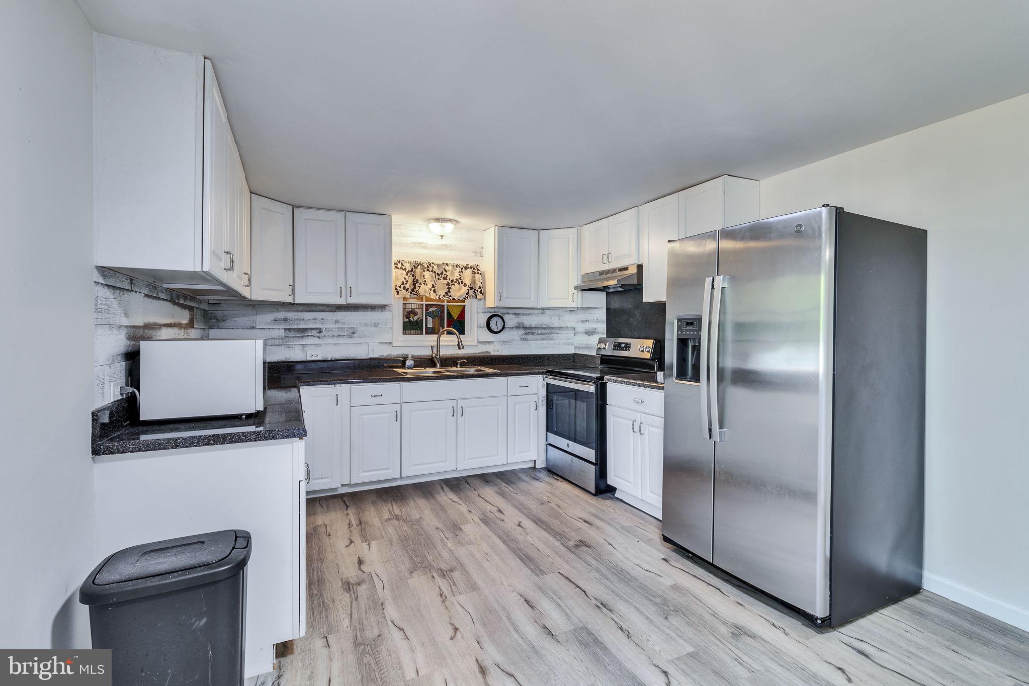 529 Taylors Beach Road Reedville, VA 22539 - Photo 2 of 57 Modern kitchen with sleek finishes.