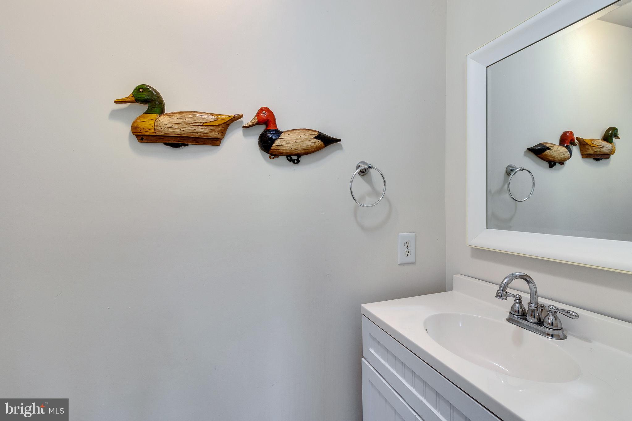 529 Taylors Beach Road Reedville, VA 22539 - Photo 21 of 57 Charming decor in a serene bathroom.