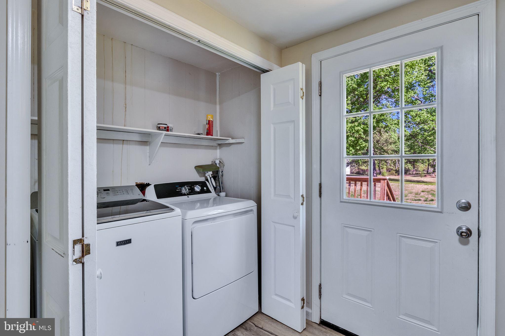 529 Taylors Beach Road Reedville, VA 22539 - Photo 5 of 57 Bright laundry nook with outdoor access.