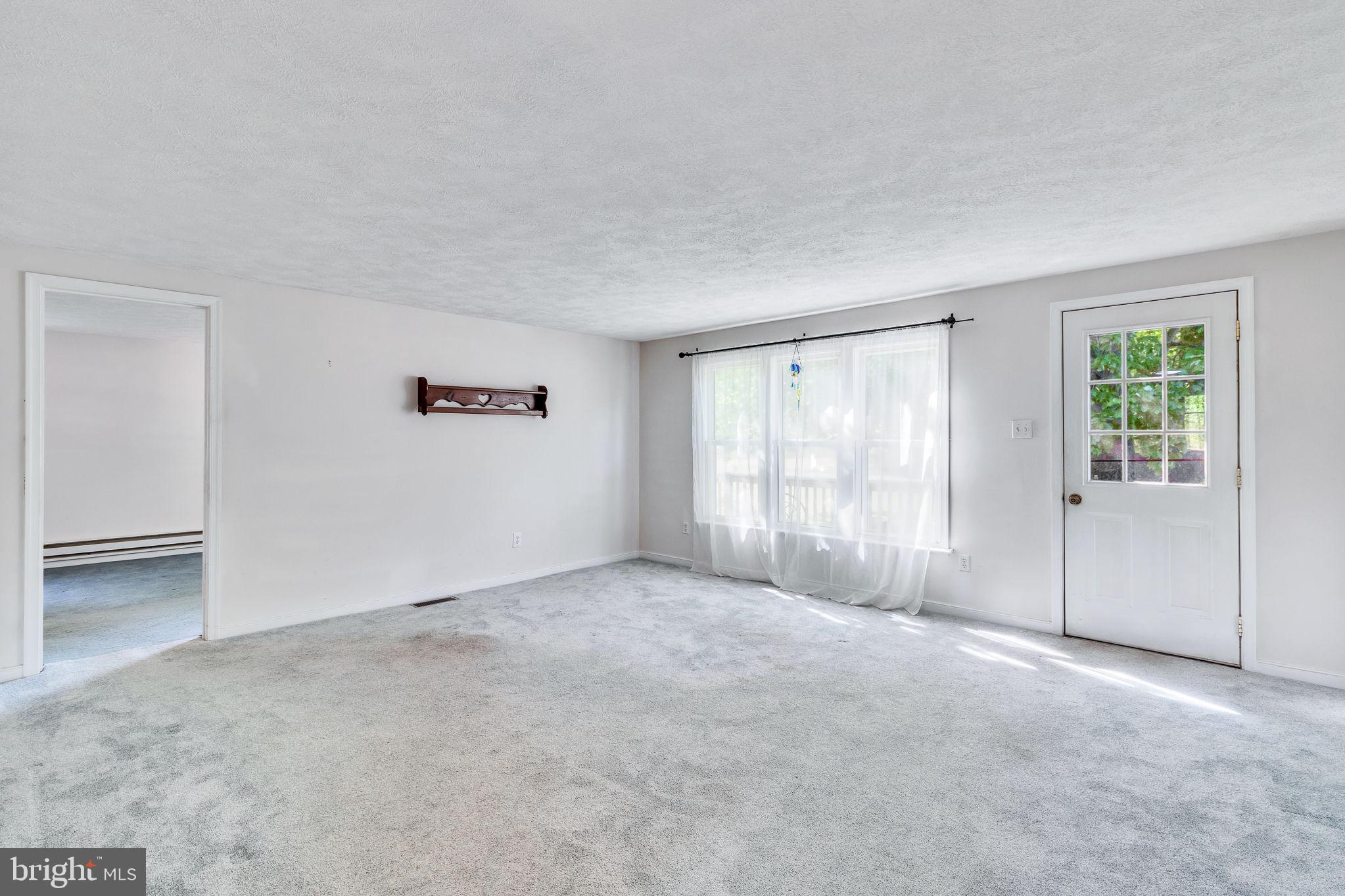 529 Taylors Beach Road Reedville, VA 22539 - Photo 7 of 57 Bright and airy living space awaits.