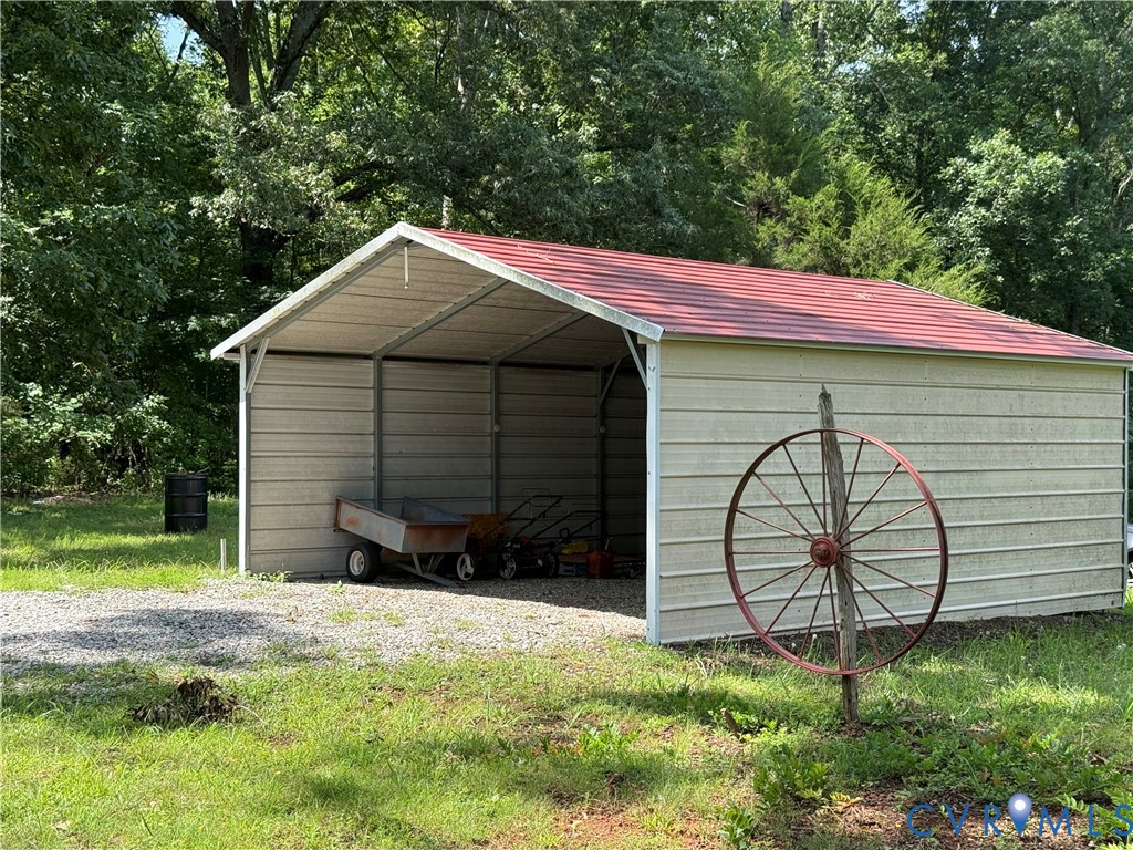 1600 Reams Road Powhatan, VA 23139 - Photo 9 of 10 Freestanding metal carport with a red-finish roof,