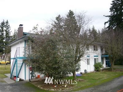 6707 Cady Road Everett, WA 98203 - Photo 1 of 1 a view of a white house with a yard