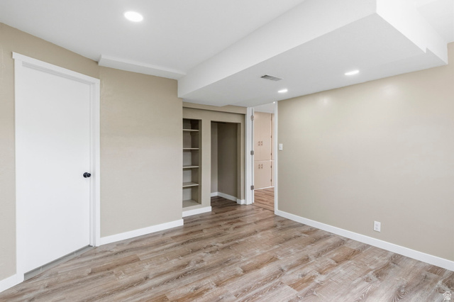 2693 Teal Way Sandy, UT 84093 - Photo 34 of 50 Spacious interior featuring wood-finish flooring, recessed lighting, and neutral wall tones