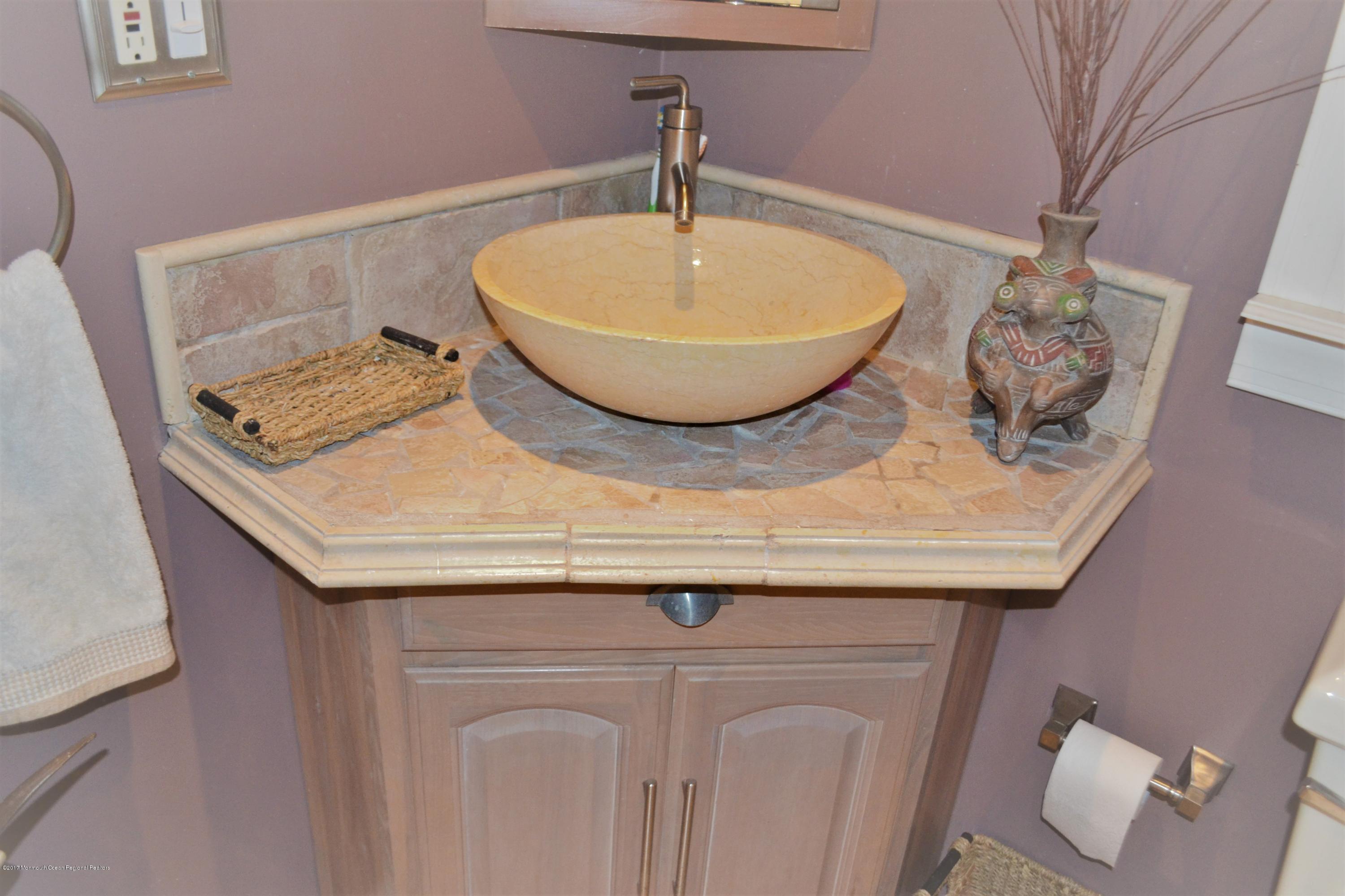 615 Midstreams Road Brick, NJ 08724 - Photo 9 of 10 a bathroom with a granite countertop sink and a mirror