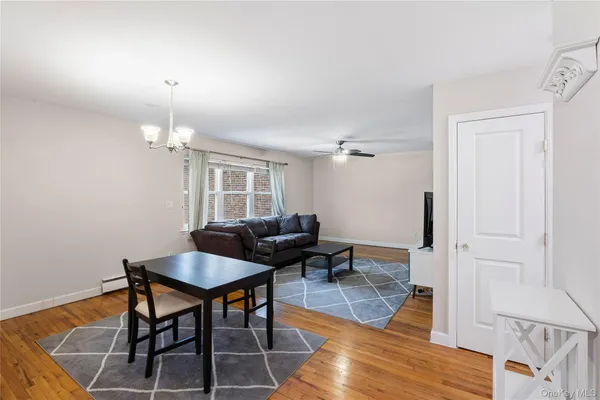a workspace room with furniture and wooden floor