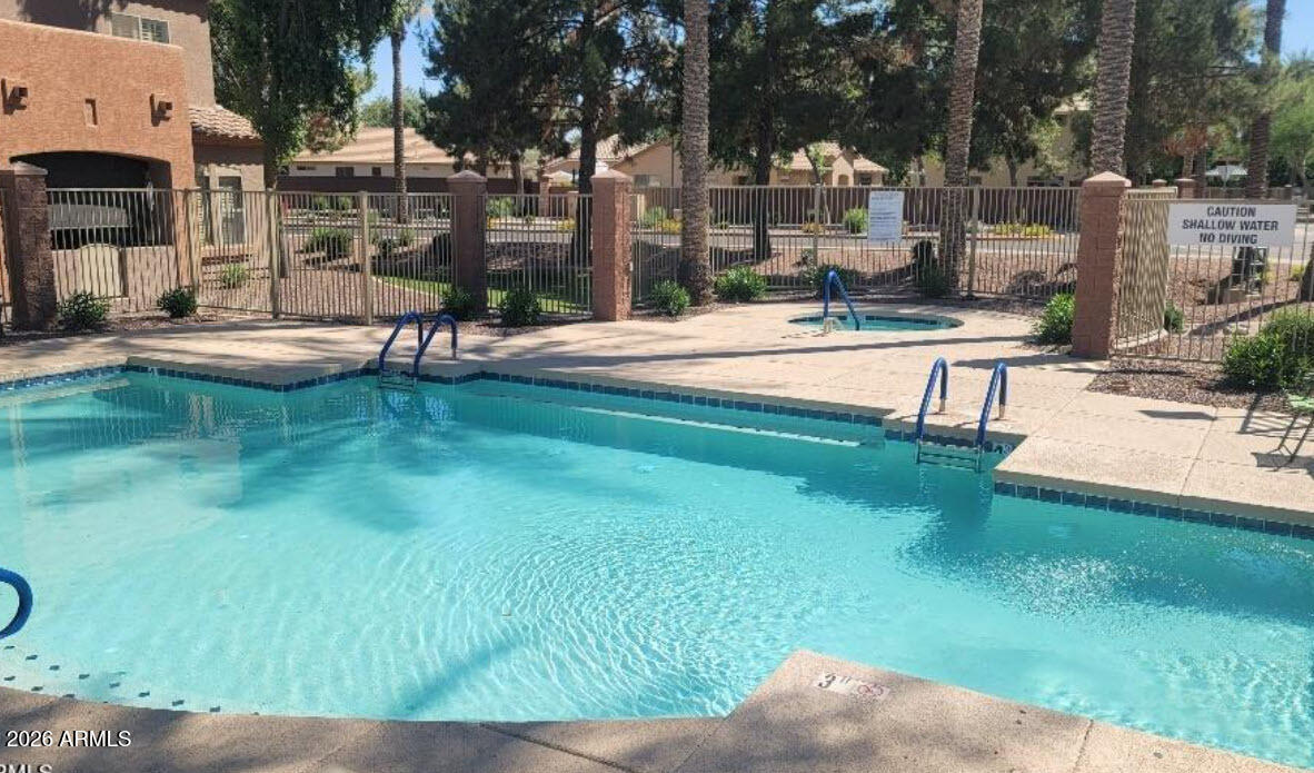 2600 East Springfield Place, Unit 109 Chandler, AZ 85286 - Photo 30 of 38 a swimming pool with outdoor view