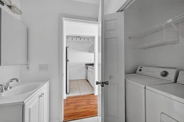a bathroom with a sink and a washing machine