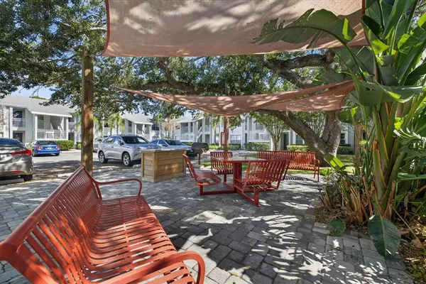 a view of a backyard with sitting area