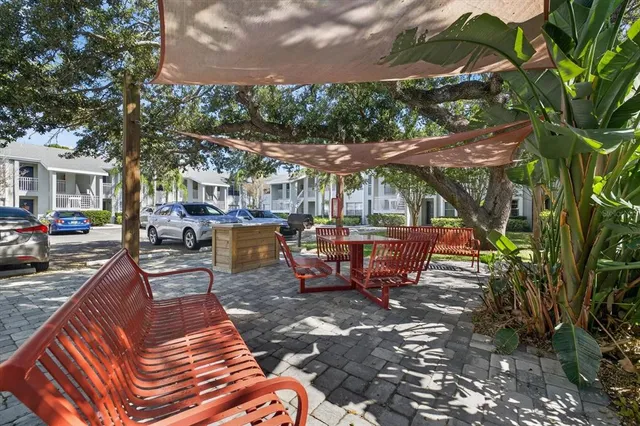 a view of a backyard with sitting area