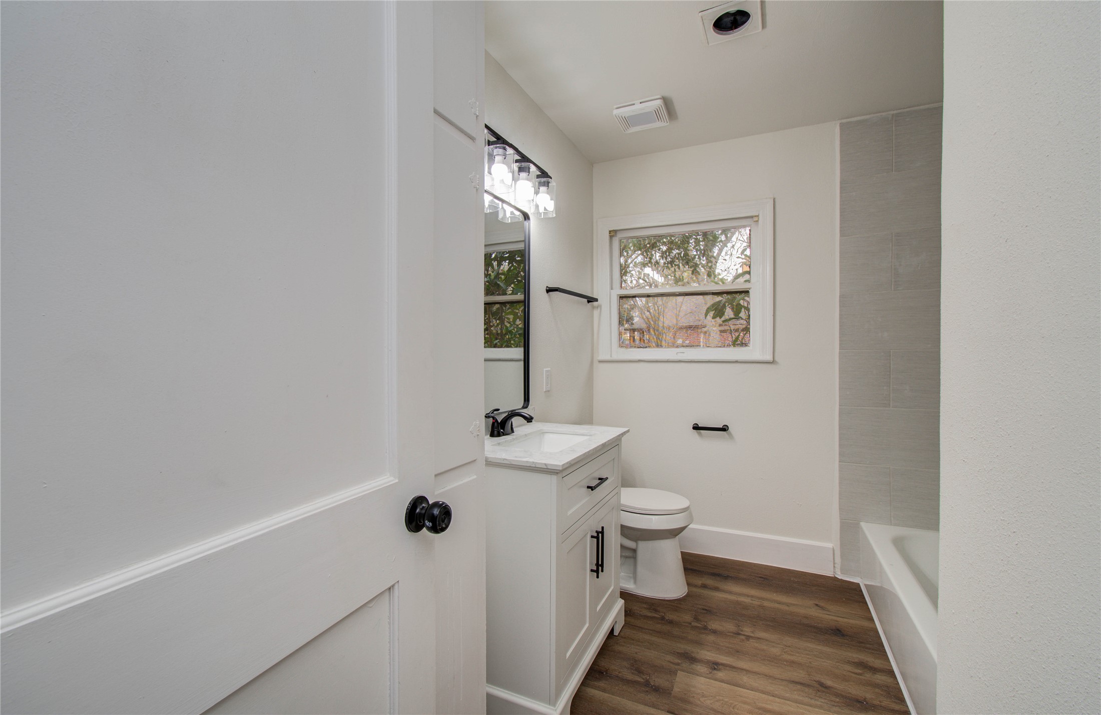 2417 Pecan Street Dickinson, TX 77539 - Photo 16 of 43 a bathroom with a toilet sink and mirror