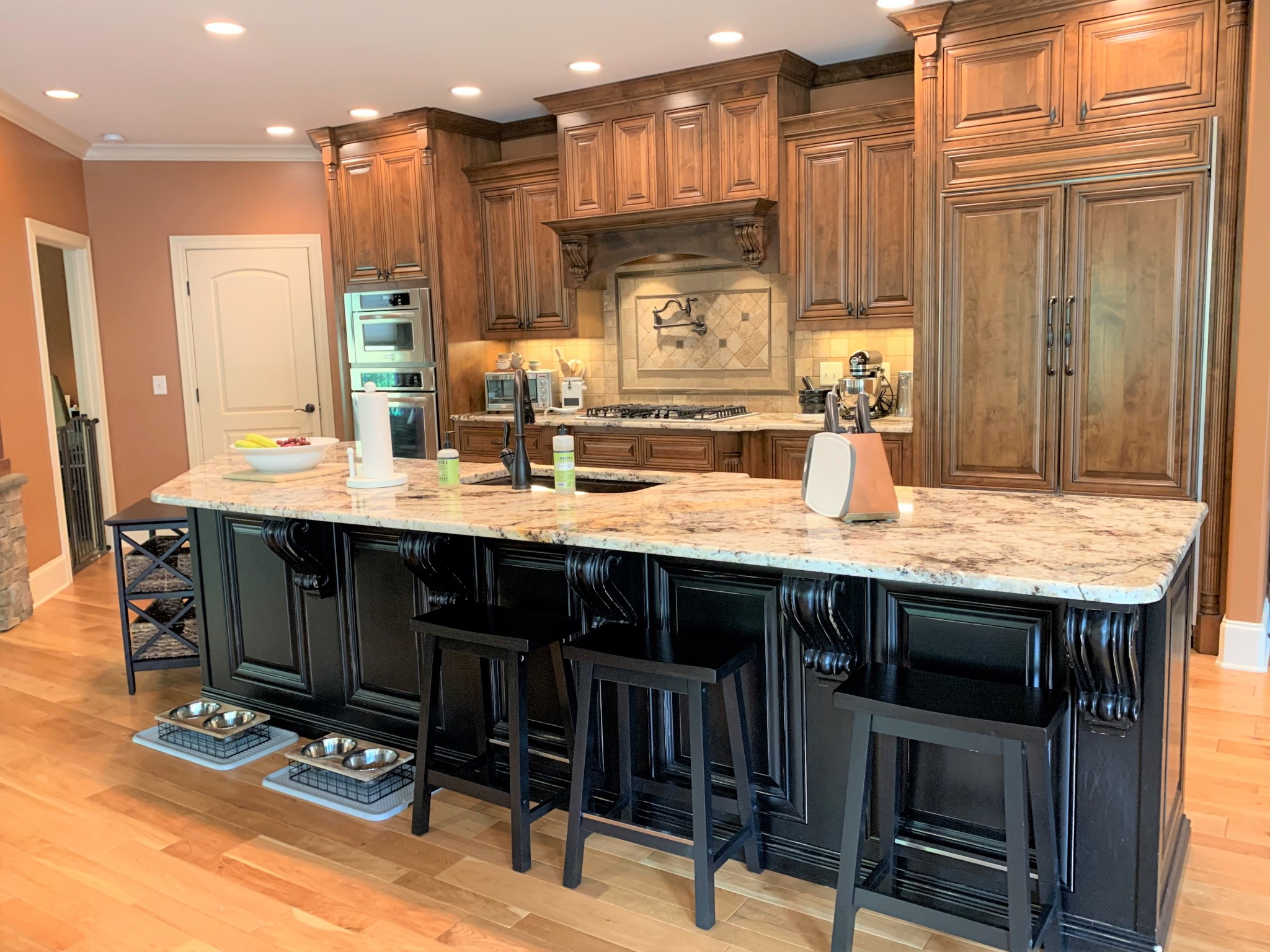 1190 Palmer Road Lebanon, TN 37090 - Photo 11 of 36 a kitchen with kitchen island granite countertop a table chairs sink and cabinets