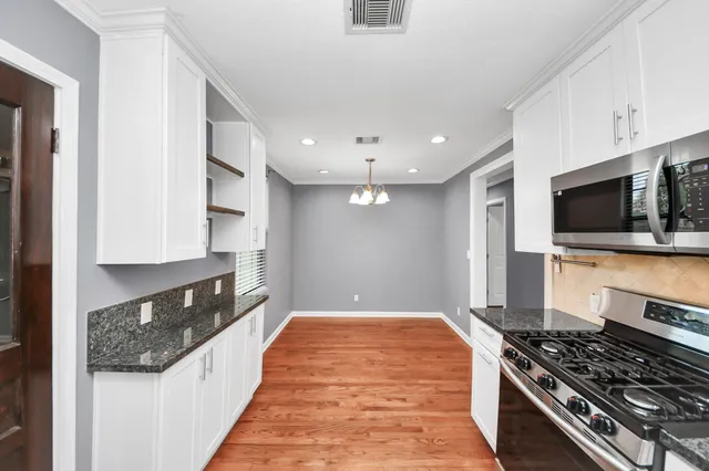 a view of storage and utility room with washer and dryer