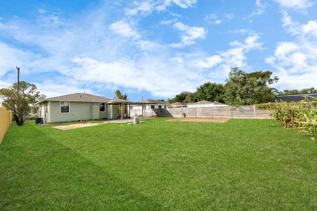 a view of yard with patio