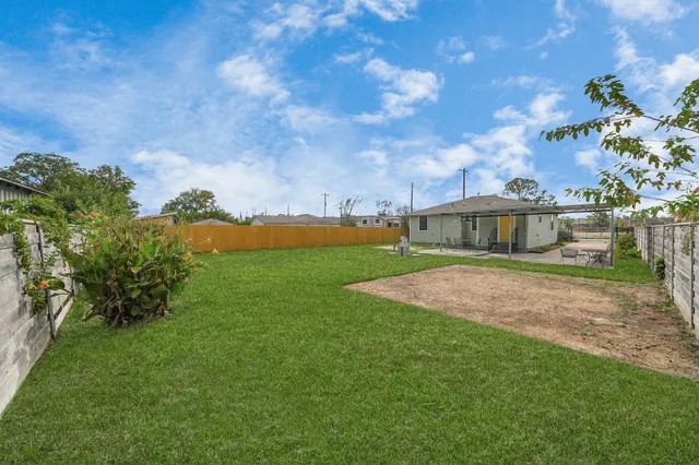 a view of a swimming pool with an outdoor seating