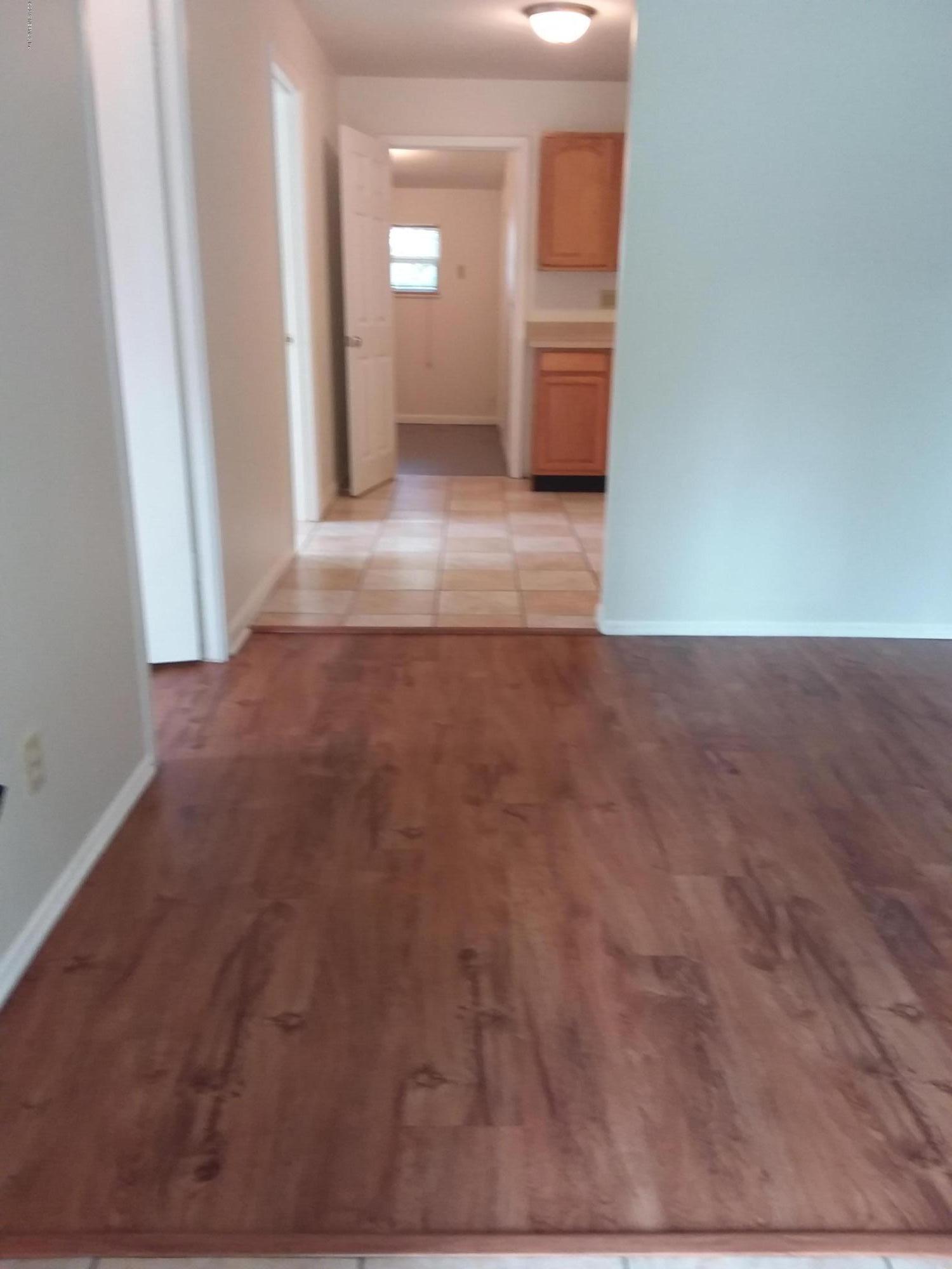 7311 Melvin Road Jacksonville, FL 32210 - Photo 2 of 24 a view of empty room with window