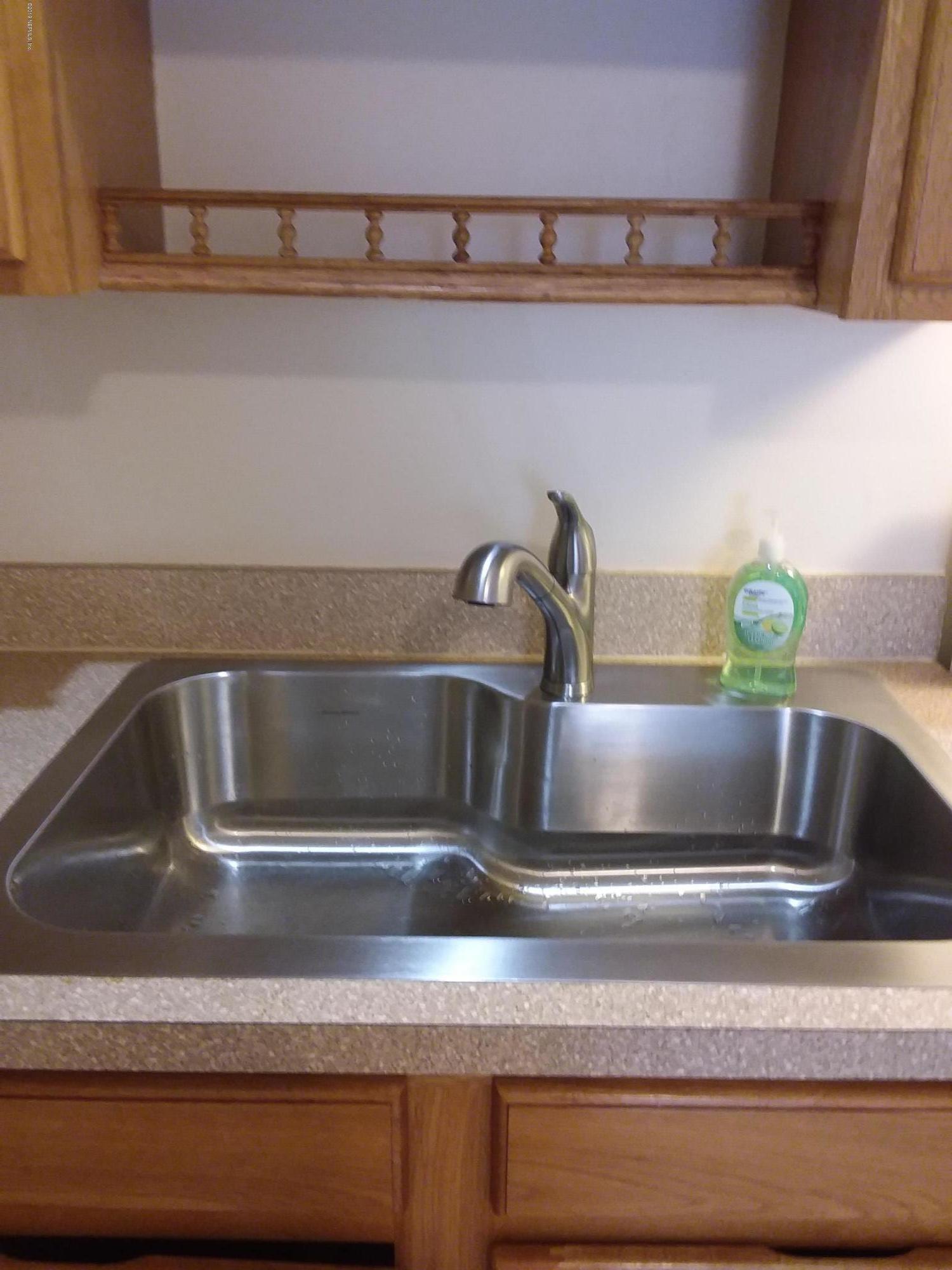 7311 Melvin Road Jacksonville, FL 32210 - Photo 6 of 24 a close view of sink and tap