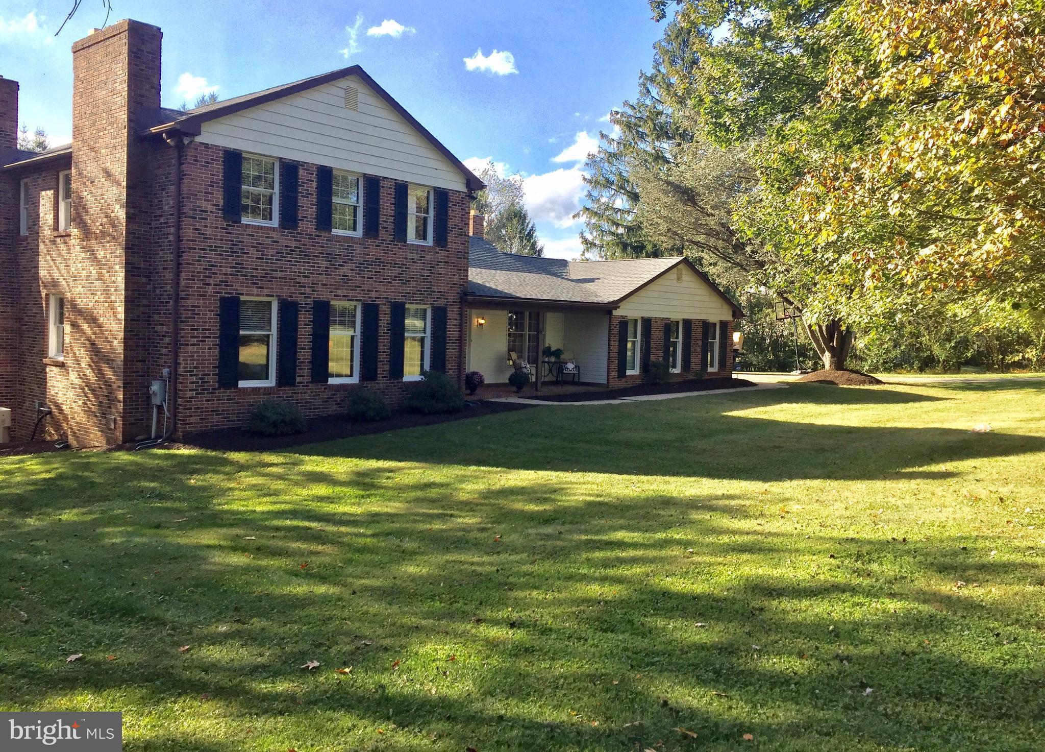 14220 Manor Road Phoenix, MD 21131 - Photo 2 of 25 a front view of a house with a yard