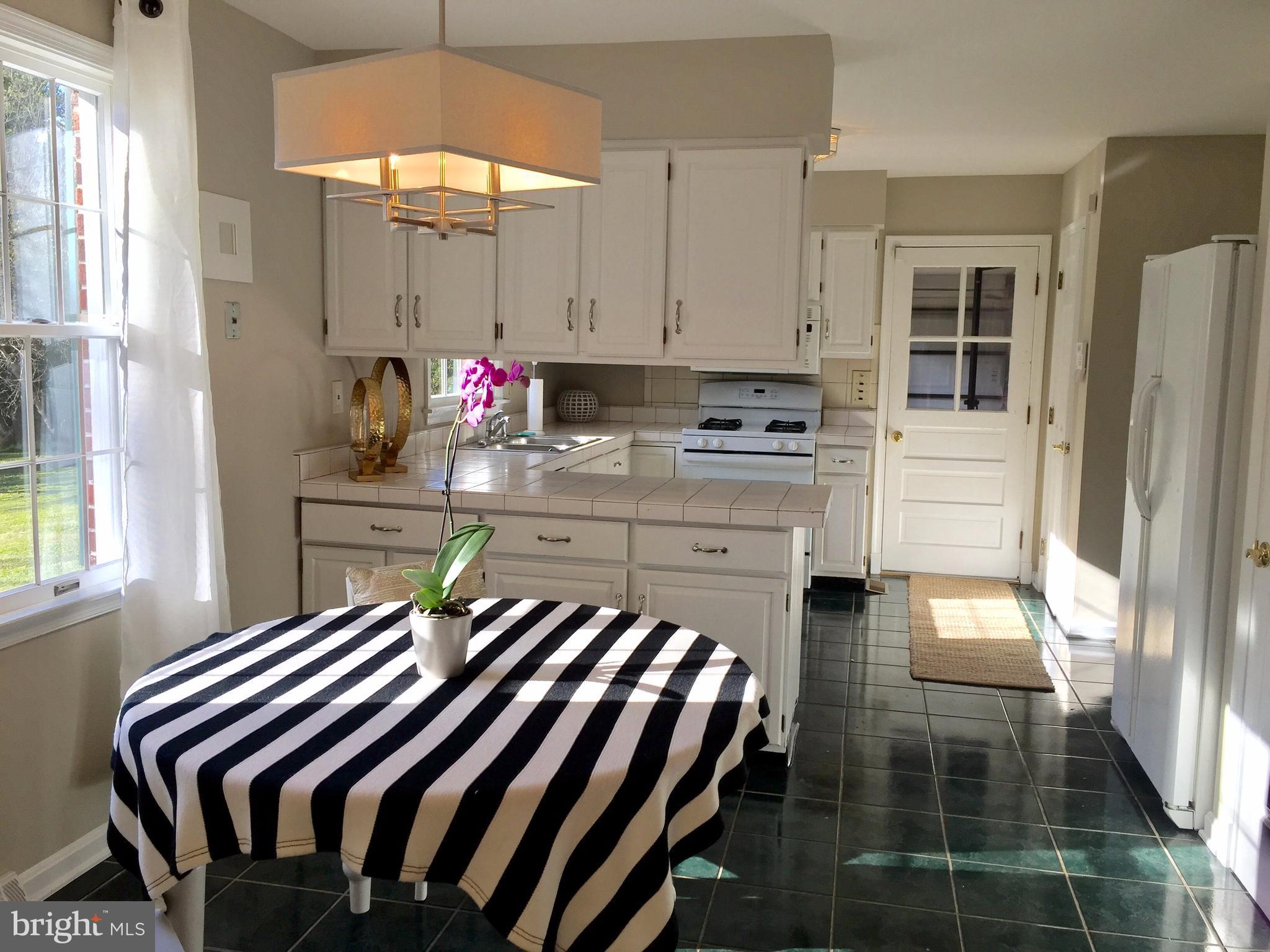 14220 Manor Road Phoenix, MD 21131 - Photo 11 of 25 a kitchen with a sink appliances and cabinets