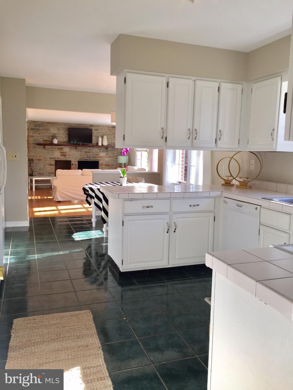14220 Manor Road Phoenix, MD 21131 - Photo 14 of 25 a kitchen with stainless steel appliances granite countertop a sink a stove and cabinets