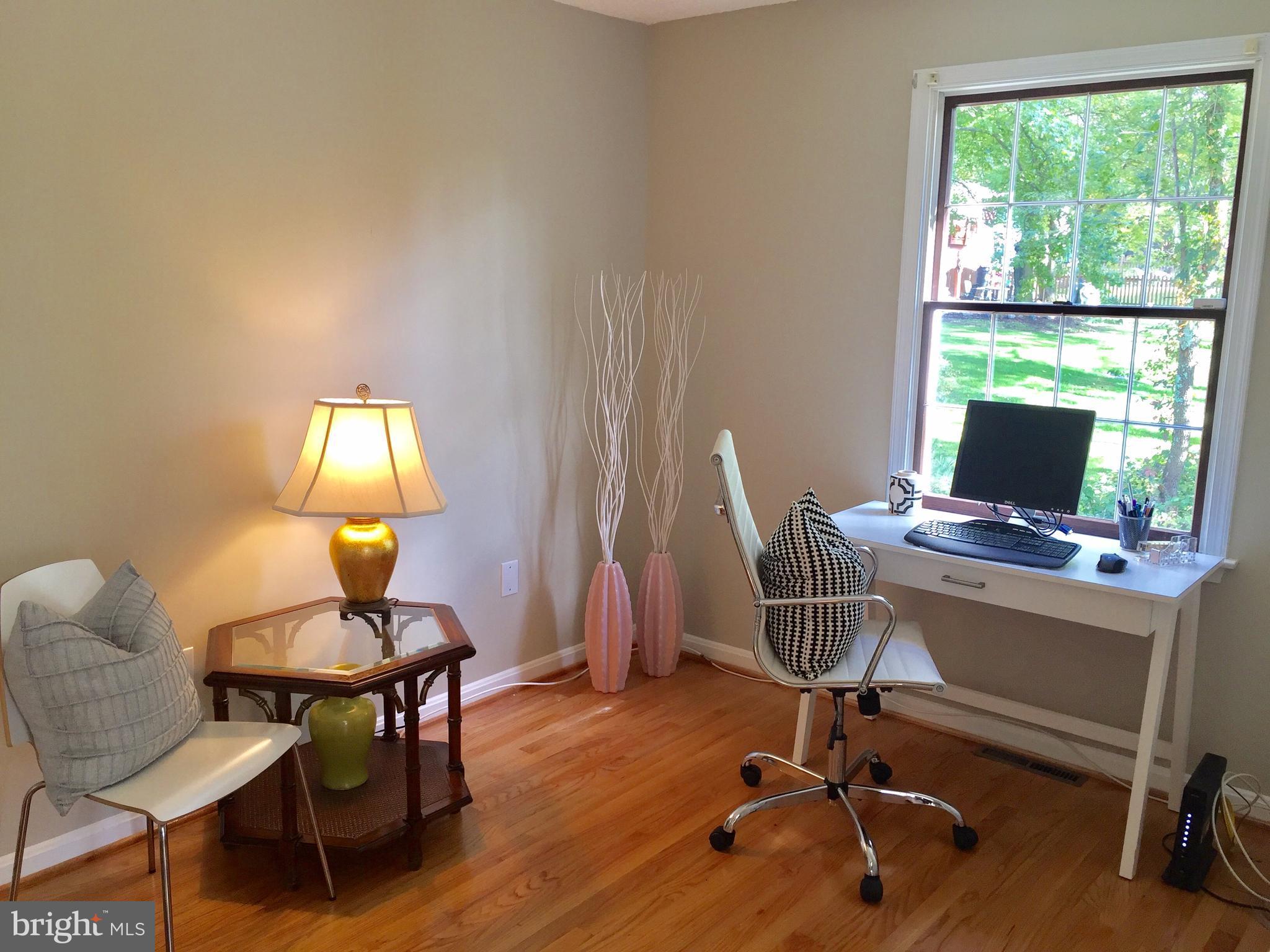 14220 Manor Road Phoenix, MD 21131 - Photo 16 of 25 a view of a workspace with furniture and a window