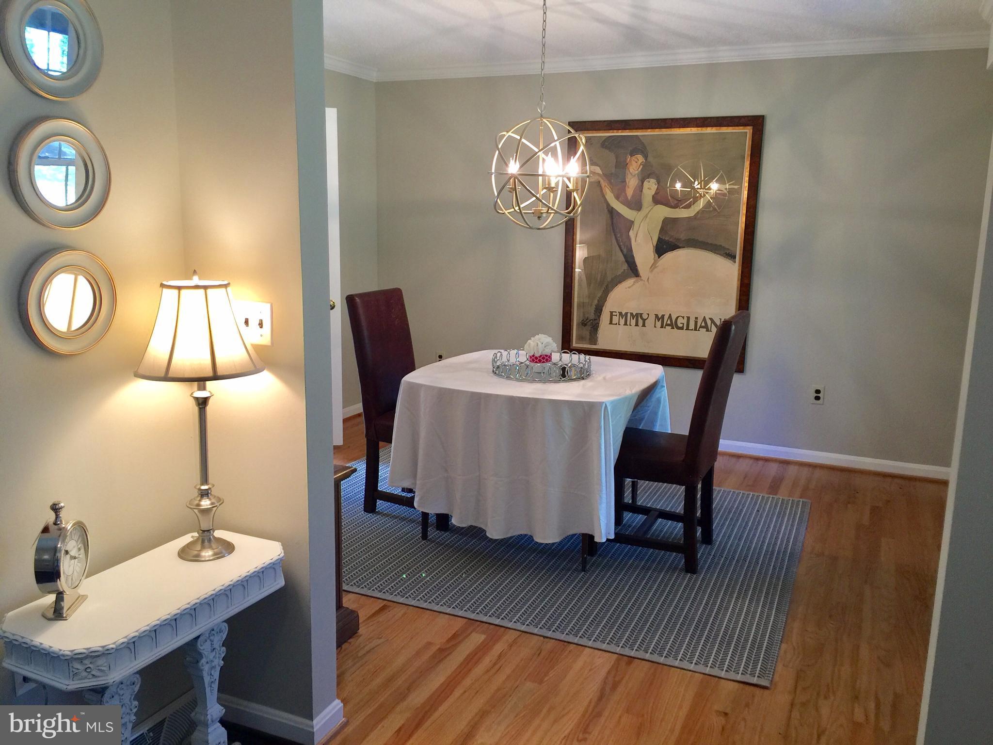 14220 Manor Road Phoenix, MD 21131 - Photo 9 of 25 a dining room with furniture and wooden floor