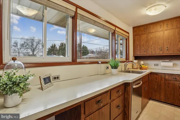 a kitchen with a sink and a window