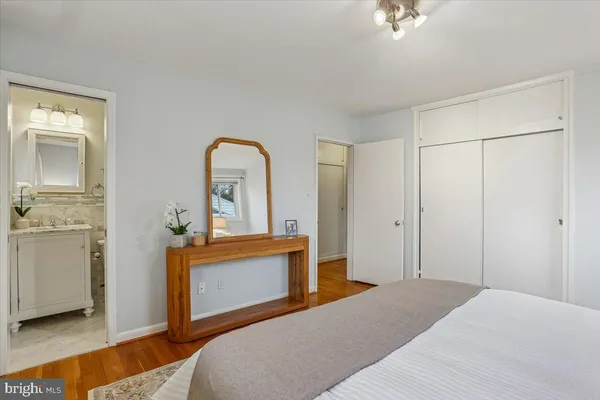 a bedroom with a bed and a dresser