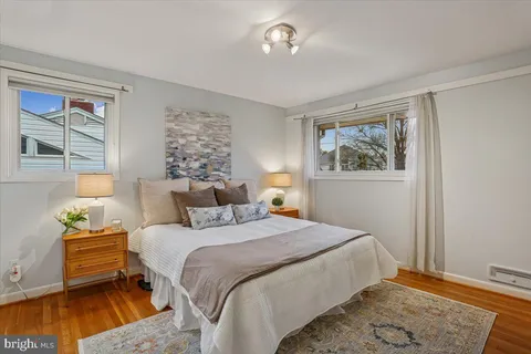 a bedroom with bed and a window
