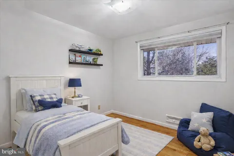 a bedroom with bed and a window