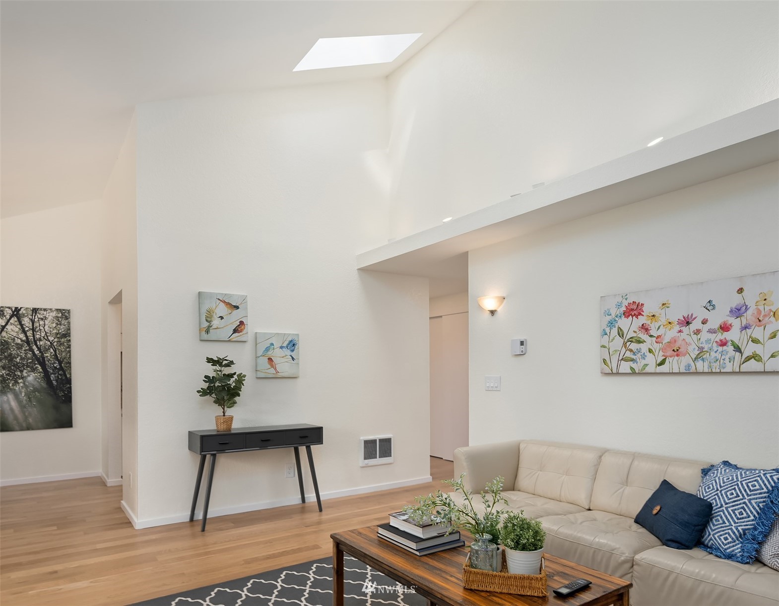 8418 240th Street Southwest, Unit A303 Edmonds, WA 98026 - Photo 14 of 23 a living room with furniture and a potted plant