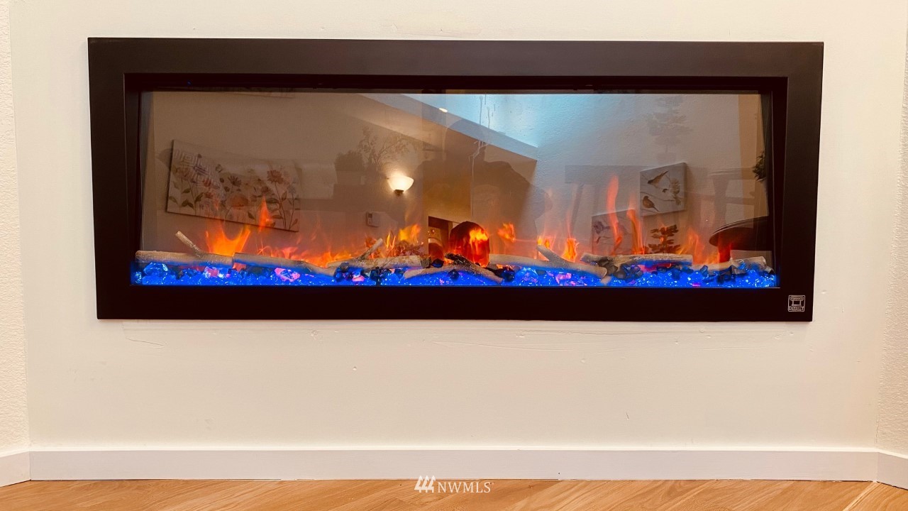 8418 240th Street Southwest, Unit A303 Edmonds, WA 98026 - Photo 19 of 23 a picture of a room with wooden floor