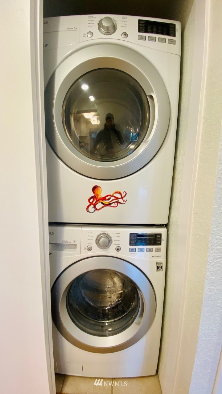8418 240th Street Southwest, Unit A303 Edmonds, WA 98026 - Photo 21 of 23 a utility room with dryer and washer
