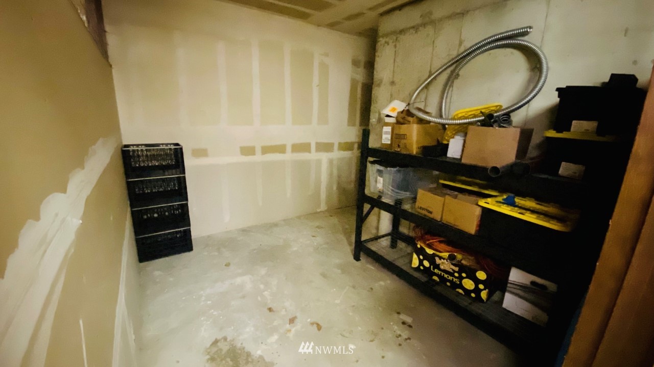 8418 240th Street Southwest, Unit A303 Edmonds, WA 98026 - Photo 22 of 23 a view of an entryway with wooden floor