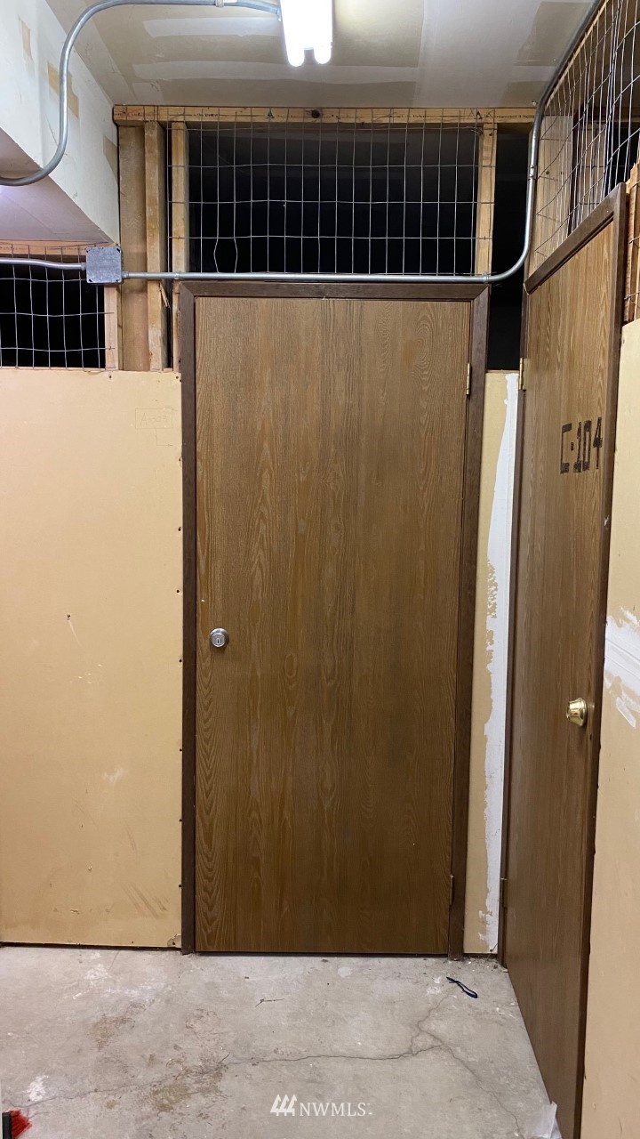 8418 240th Street Southwest, Unit A303 Edmonds, WA 98026 - Photo 23 of 23 a view of a house with a wooden door