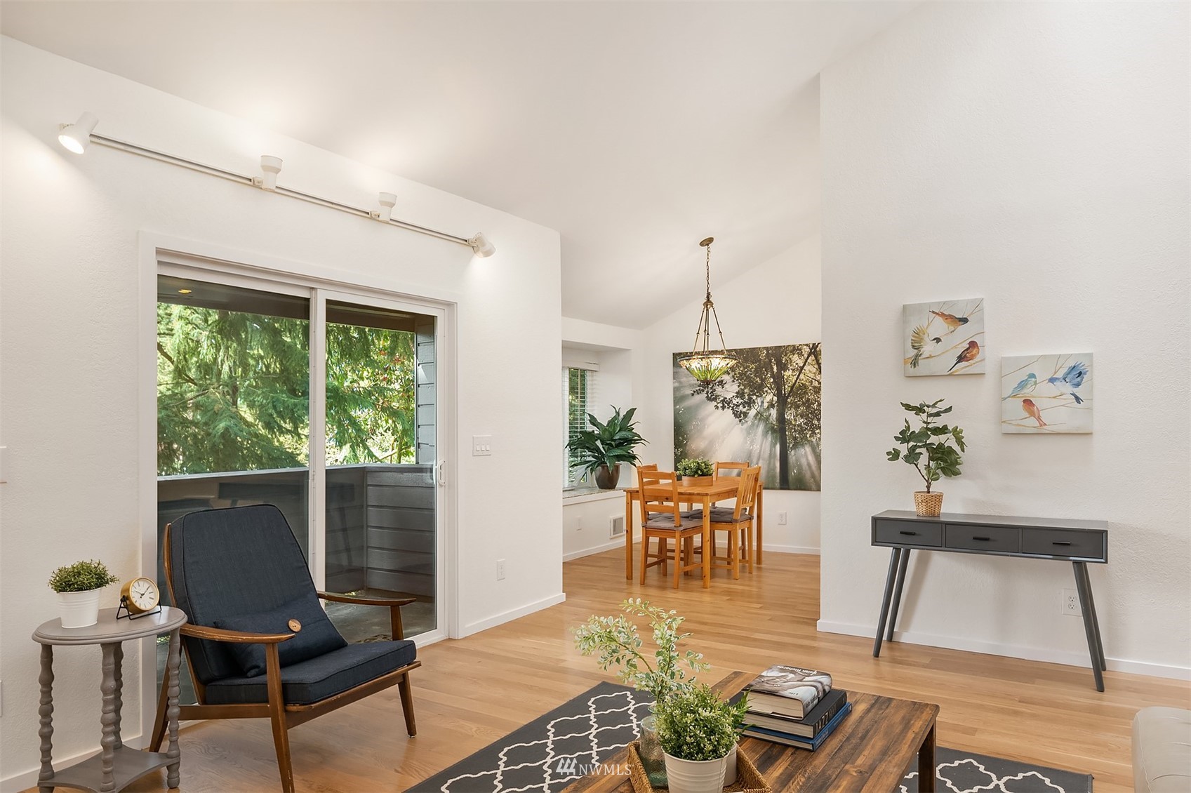 8418 240th Street Southwest, Unit A303 Edmonds, WA 98026 - Photo 4 of 23 a living room with furniture and a window