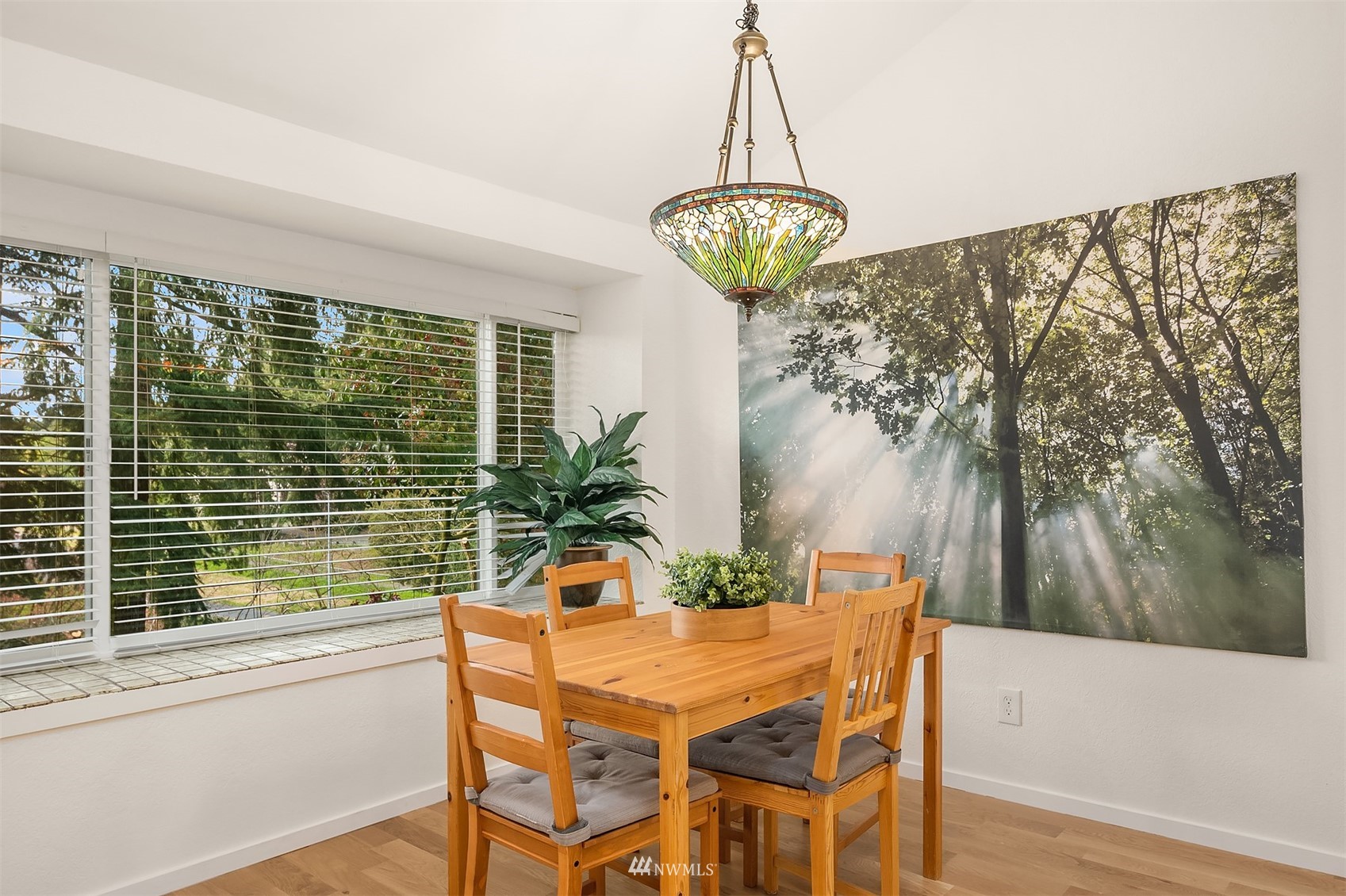 8418 240th Street Southwest, Unit A303 Edmonds, WA 98026 - Photo 5 of 23 a view of a dining room with furniture window and outside view