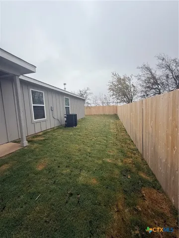 a view of a backyard of the house