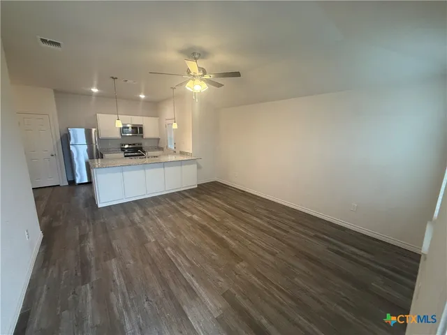 a view of kitchen and sink