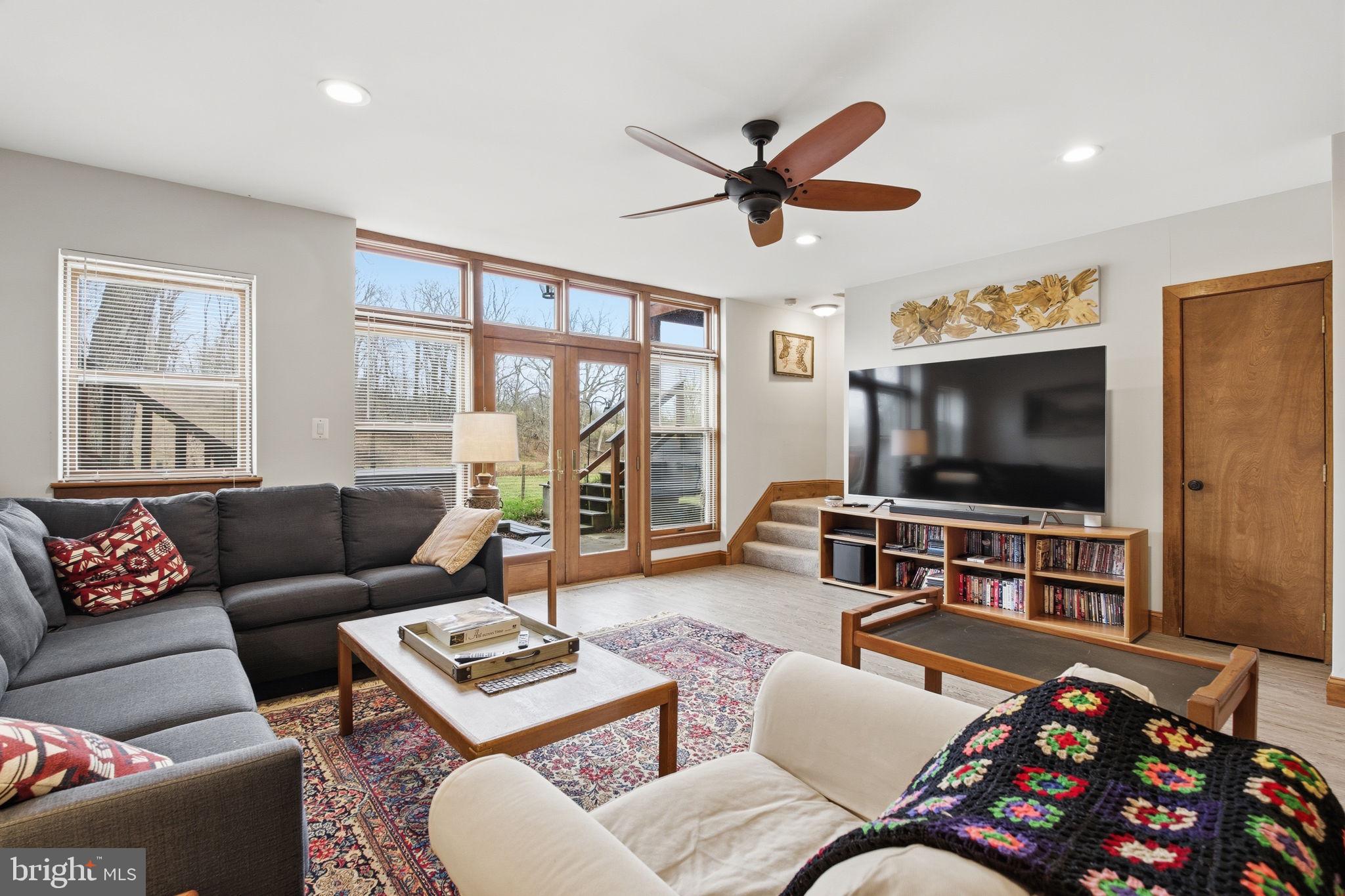 21627 Gunpowder Road Manchester, MD 21102 - Photo 11 of 32 a living room with furniture and a flat screen tv with wooden floor