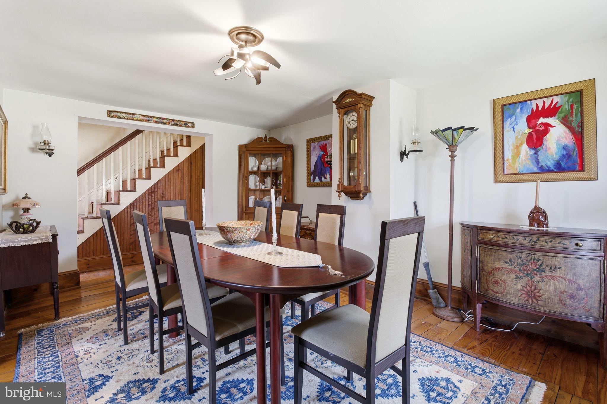 21627 Gunpowder Road Manchester, MD 21102 - Photo 12 of 32 a view of a dining room with furniture and wooden floor