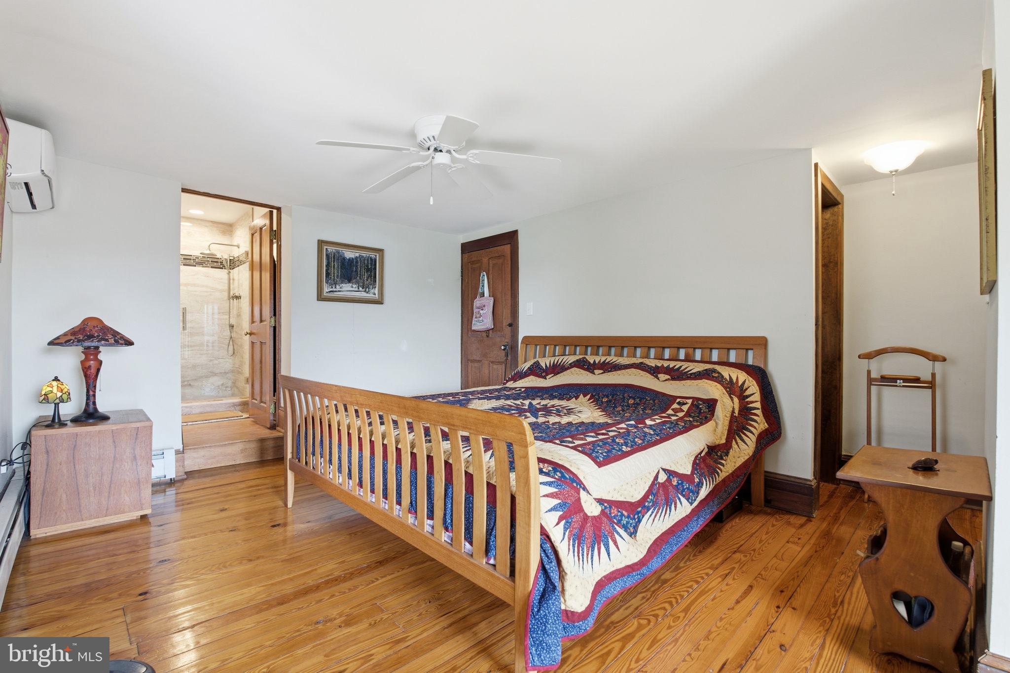 21627 Gunpowder Road Manchester, MD 21102 - Photo 13 of 32 a bedroom with bed and wooden floor