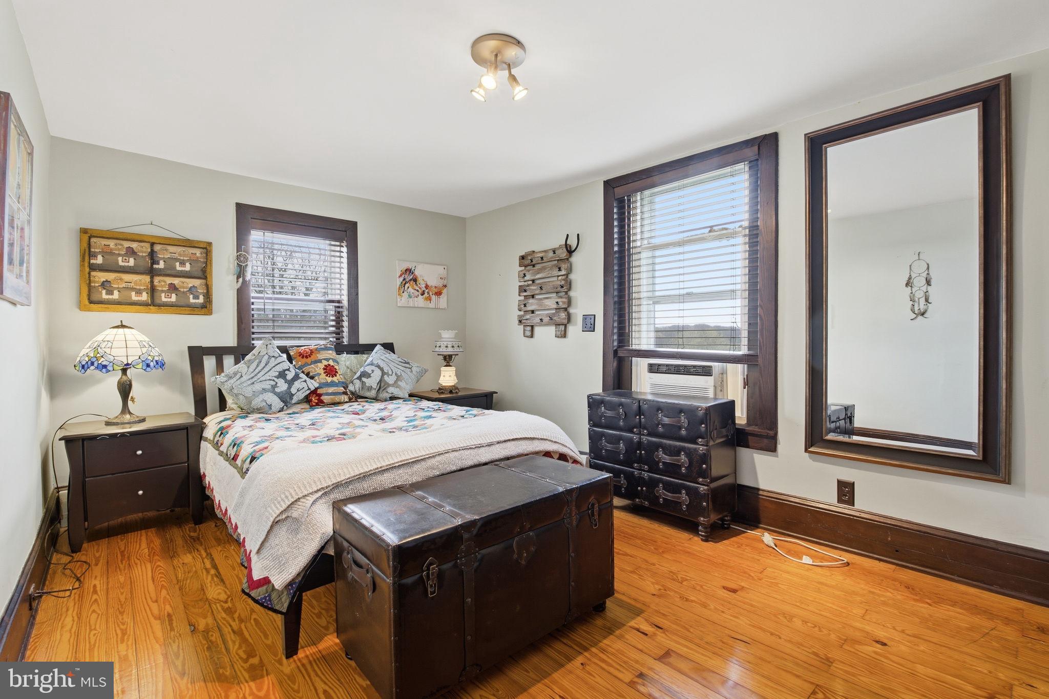 21627 Gunpowder Road Manchester, MD 21102 - Photo 14 of 32 a bed room with a bed and a tv