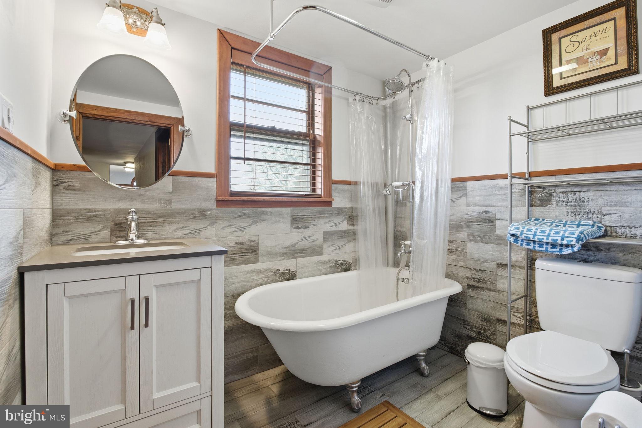 21627 Gunpowder Road Manchester, MD 21102 - Photo 16 of 32 a bathroom with a toilet sink and mirror