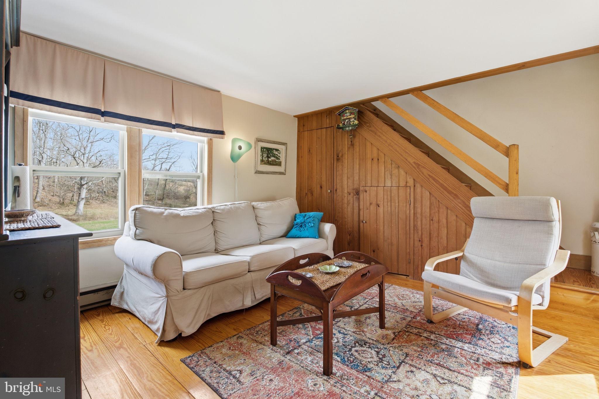 21627 Gunpowder Road Manchester, MD 21102 - Photo 21 of 32 a living room with furniture and a large window