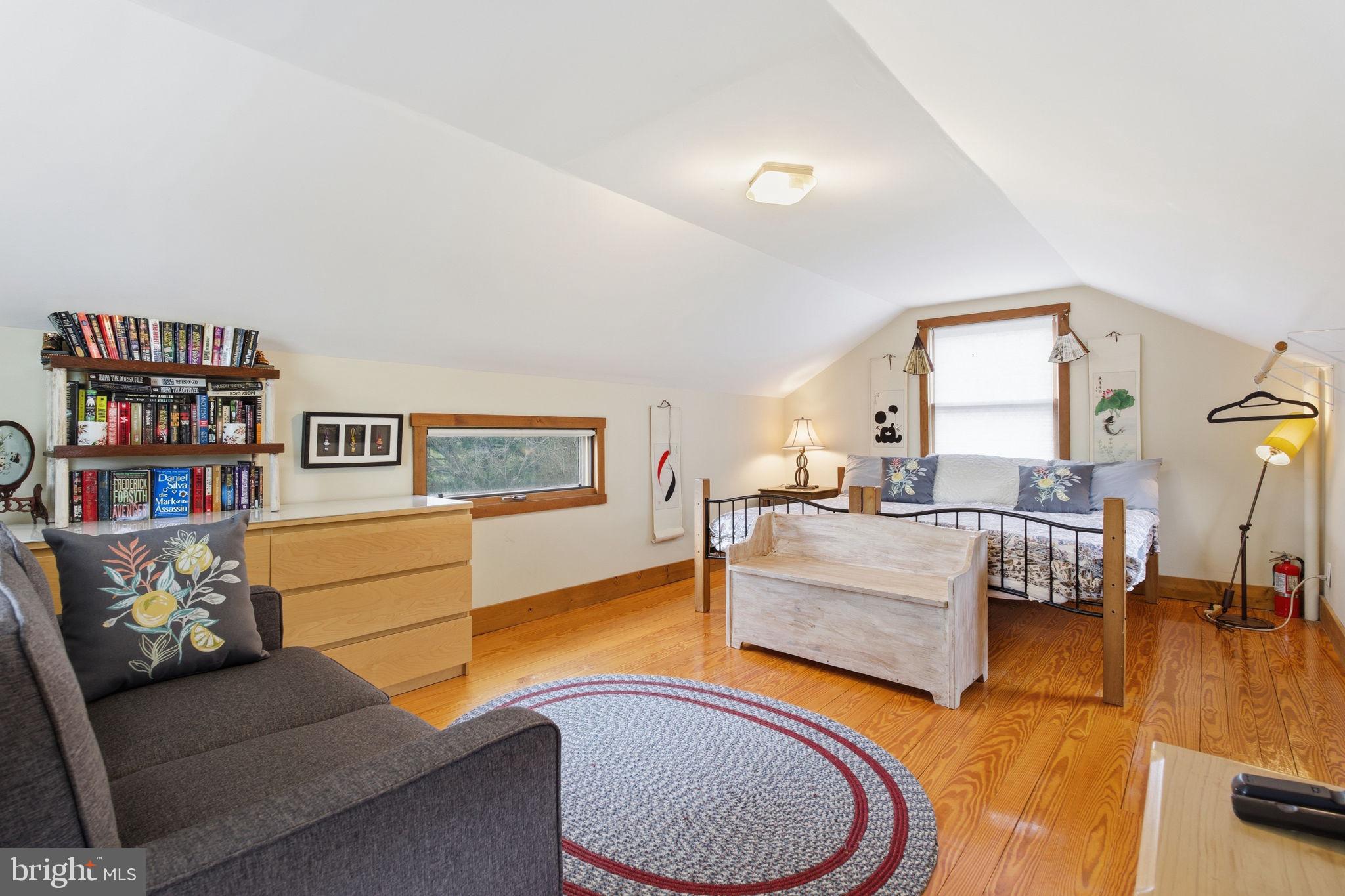 21627 Gunpowder Road Manchester, MD 21102 - Photo 22 of 32 a living room with furniture and a book shelf