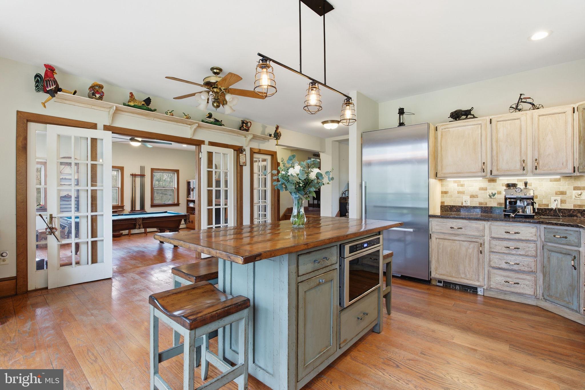 21627 Gunpowder Road Manchester, MD 21102 - Photo 7 of 32 a kitchen with stainless steel appliances granite countertop a stove and cabinets