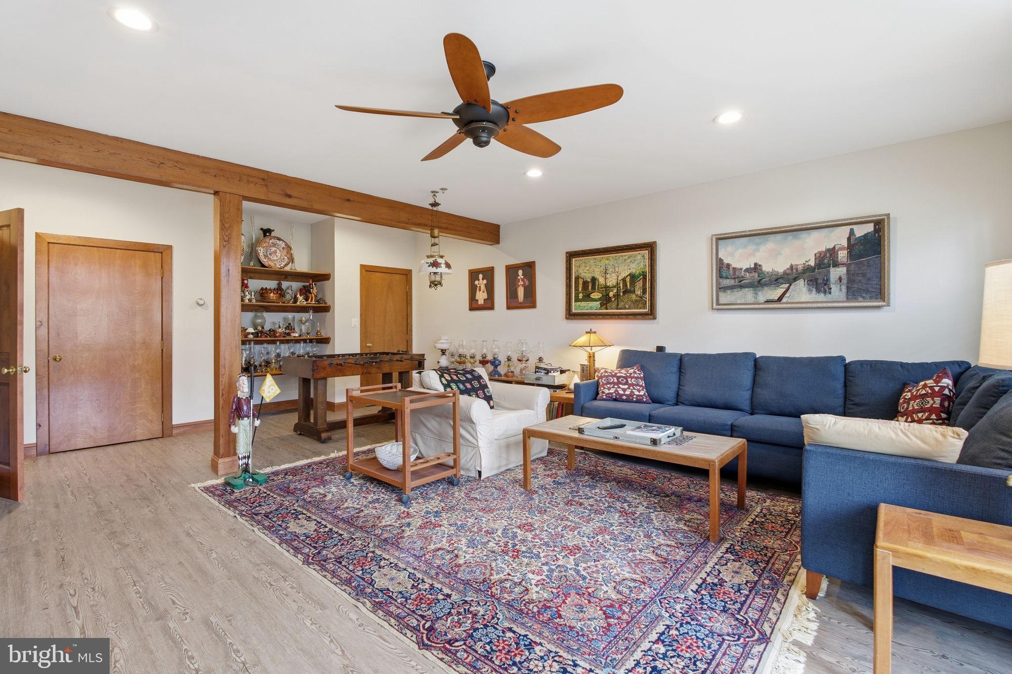 21627 Gunpowder Road Manchester, MD 21102 - Photo 10 of 32 a living room with furniture a rug and a ceiling fan